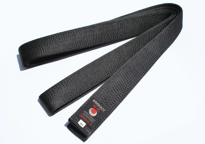 Black karate belt with stitched texture and Kamikaze embroidery on a white background